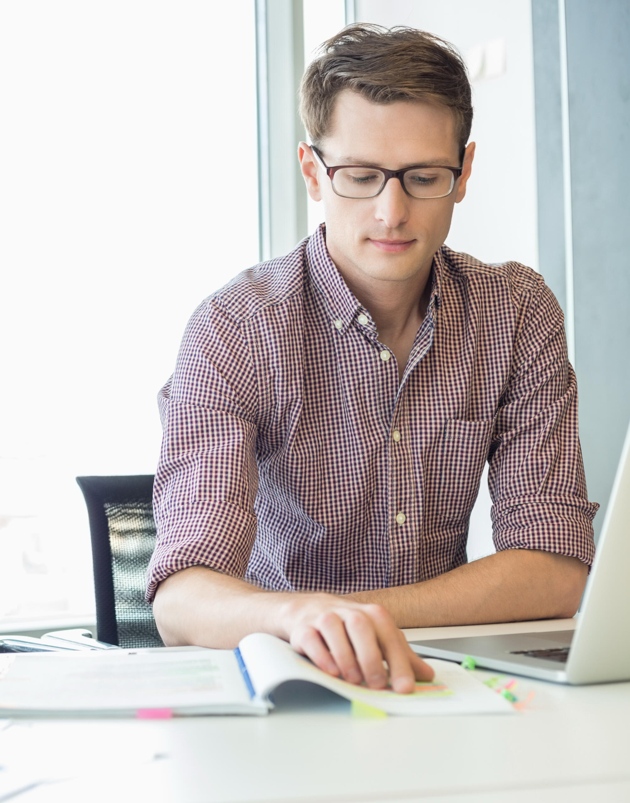 A young adult professional uses speedreading lessons to study for his college courses.